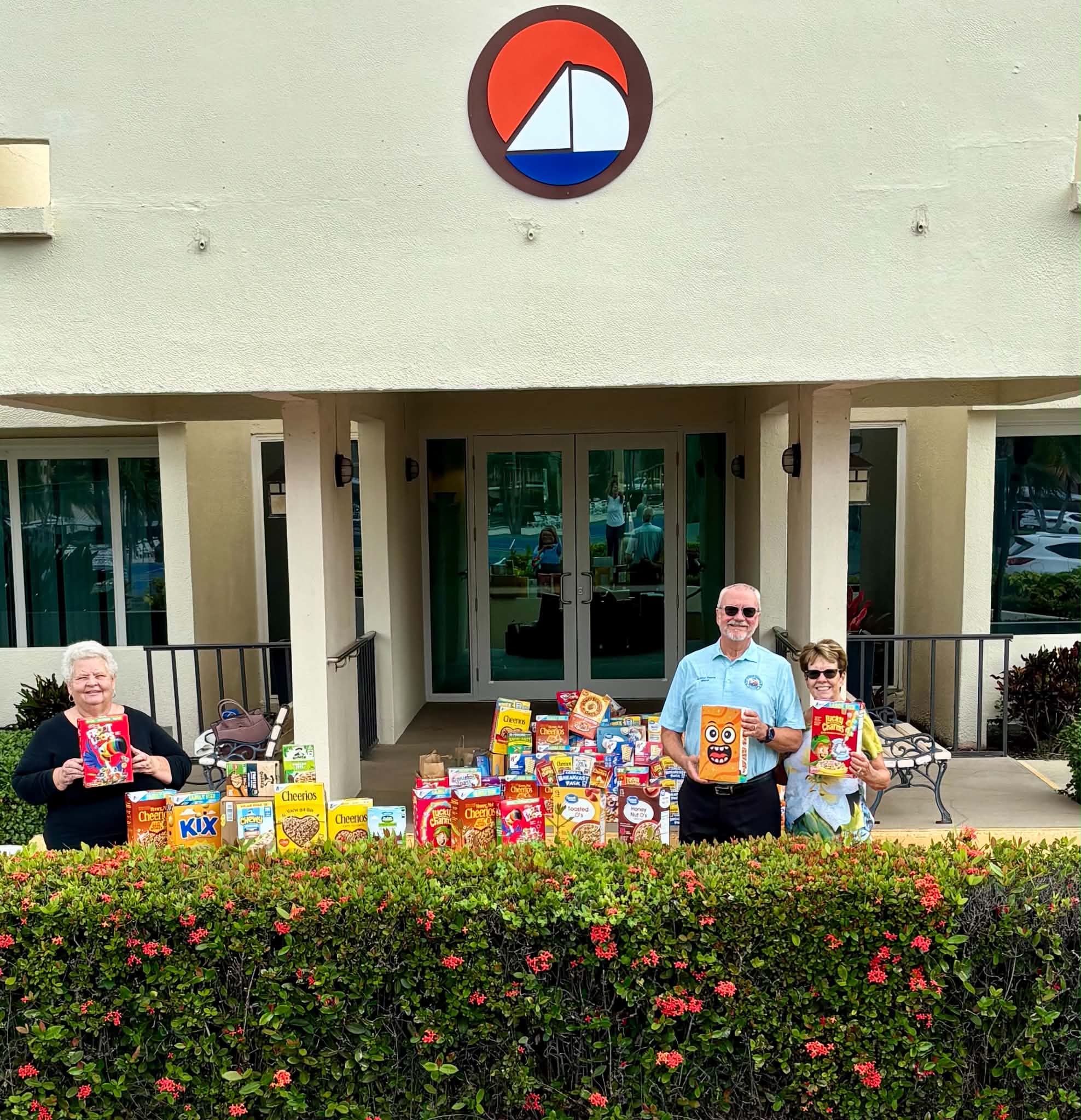 Group photo posing with cereal outside of condo